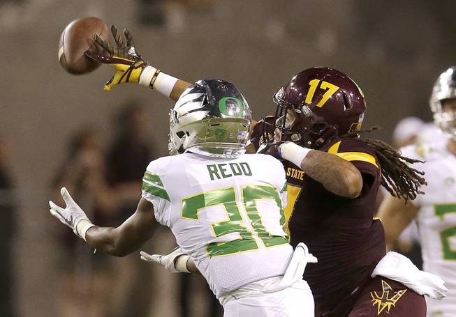 Arizona State defensive back J'Marcus Rhodes (17) gets a hand on the pass intended for Oregon wide receiver Alfonso Cobb during the second half during an NCAA college football game, Saturday, Sept. 23, 2017, in Tempe, Ariz. 