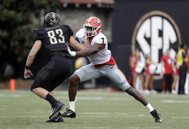 Georgia linebacker Lorenzo Carter (7) plays against Vanderbilt tight end Nathan Marcus (83) in the first half of an NCAA college football game Saturday, Oct. 7, 2017, in Nashville, Tenn. 