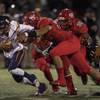 Legacy QB Roberto Valenzuela (5) is sacked by Arbor View's Tai Tuinei (54) versus Legacy during their high school football playoff game on Thursday, Nov. 8, 2017.