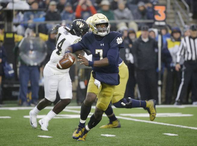 Notre Dame quarterback Brandon Wimbush looks to pass against Wake Forest during the first half of an NCAA college football game Saturday, Nov. 4, 2017, in South Bend, Ind. 