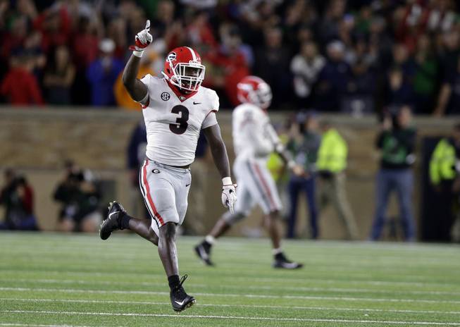Georgia linebacker Roquan Smith (3) celebrates after a Georgia fumble recovery late in the second half of an NCAA college football game against Notre Dame in South Bend, Ind., Saturday, Sept. 9, 2017. Georgia won 20-19. (AP Photo/Michael Conroy)