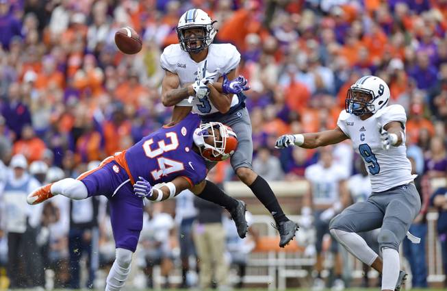 Citadel's Wally Wilmore (3) breaks up a pass intended for Clemson's Ray-Ray McCloud (34) with Khafari Buffalo watching during the first half of an NCAA college football game Saturday, Nov. 18, 2017, in Clemson, S.C. (AP Photo/Richard Shiro)