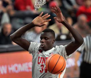 UNLV Runnin' Rebels forward Cheikh Mbacke Diong (34) slam dunks the ball over the Utah Runnin' Utes during their MGM Main Event basketball game at the T-Mobile Arena on Wednesday, Nov 22, 2017.