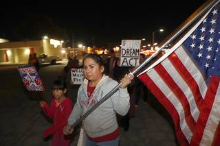 Sandra Perez and her daughter Melina Leon, 8, participate in an immigration march and rally organized by Make the Road Nevada Thursday, Nov. 30, 2017. Marchers called on politicians to pass a clean bill for the Deferred Action for Childhood Arrivals (DACA) program and to extend Temporary Protected Status (TPS) for immigrants of select countries.