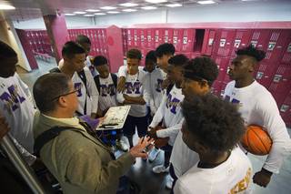 Sunrise Mountain High School basketball coach John Teran talks with players in the locker room before a game at Eldorado High School Monday, Dec. 4, 2017.