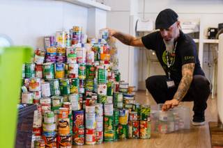 Rob Ruckus, manager at Inyo Fine Cannabis Dispensary, prepares to deliver non-perishable food donations during a holiday food drive at Inyo Fine Cannabis Dispensary in Las Vegas, Thursday, Dec. 14, 2017. Donations benefit veteran residents of Veteran's Village.