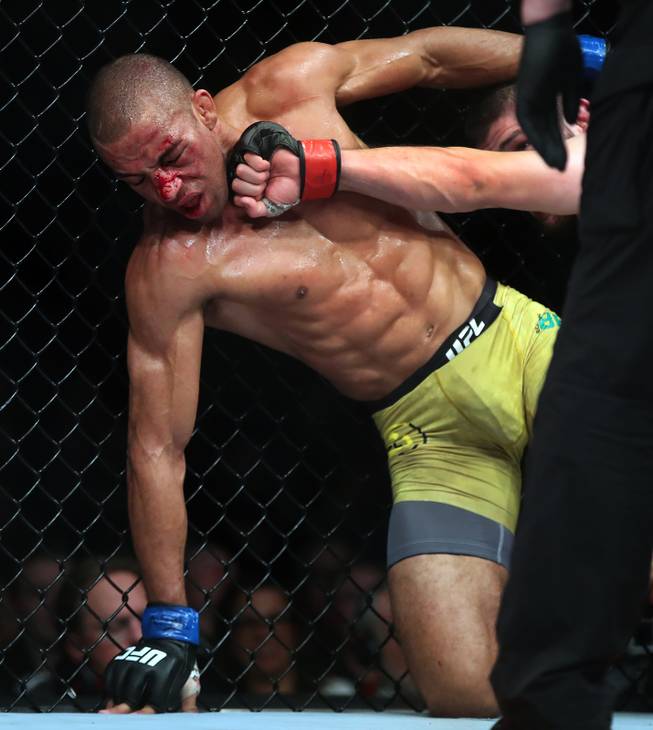 Lightweight Edson Barboza is caught by another punch from Khabib Nurmagomedov during their UFC219 fight at the T-Mobile Arena on Saturday, Dec. 30, 2017.