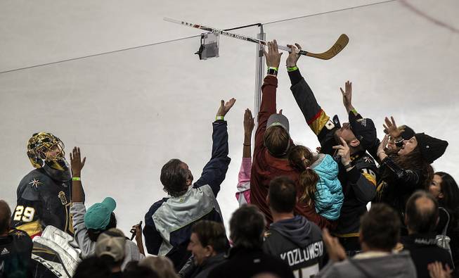 Vegas Golden Knights goaltender Marc-Andre Fleury looks to fans after tossing his stick over the glass following their victory over Nashville 3-0 at the T-Mobile Arena, Tuesday, Jan. 2, 2018.