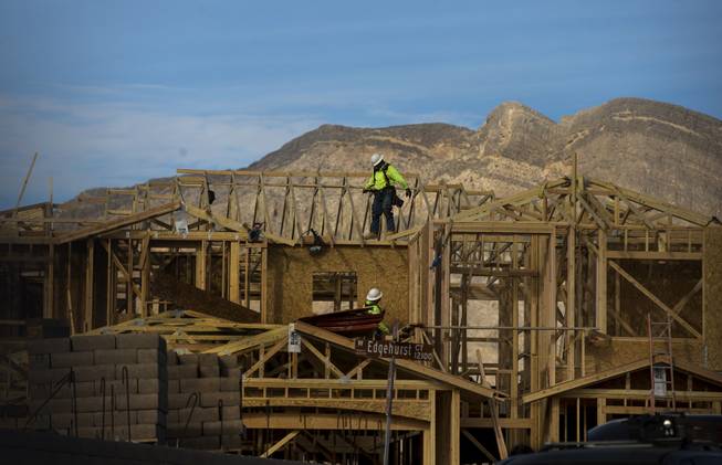 Workers continue with housing construction in Summerlin as growth is on the rise about the Las Vegas area on Wednesday, Jan. 3, 2018.