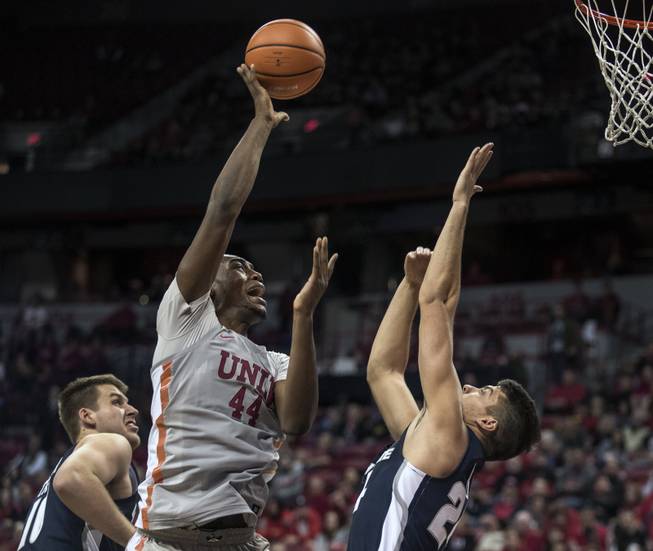 UNLV Rebels forward Brandon McCoy (44) flicks in a basket over Utah State Aggies guard Diogo Brito (24) during their game at the Thomas & Mack Center on Saturday, Jan. 6, 2018.