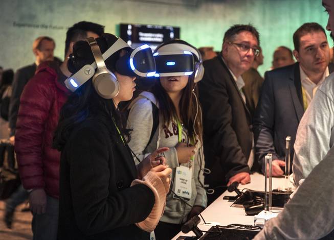 Attendees test out the new Sony virtual reality gear as CES takes over the Las Vegas Convention Center on Tuesday, Jan. 9, 2018.