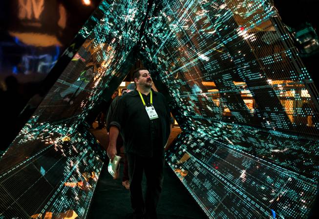 Mark Lindsay takes in the 5G Mega tunnel by Intel as CES takes over the Las Vegas Convention Center on Tuesday, Jan. 9, 2018.