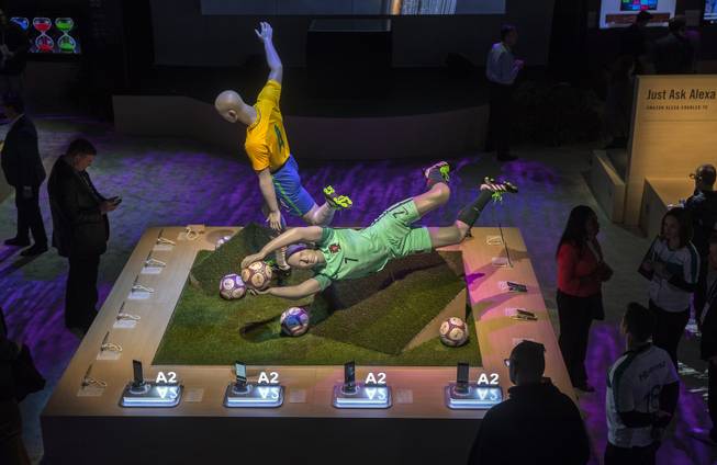 New phones can be tested with soccer-playing mannequins as CES takes over the Las Vegas Convention Center on Tuesday, Jan. 9, 2018.
