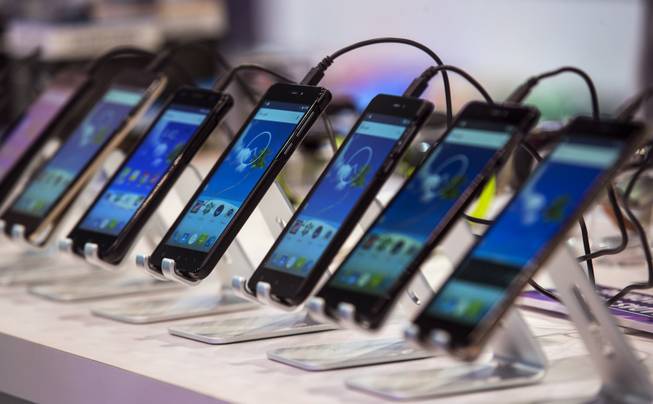 Numerous phones of every make and model can be viewed by attendees as CES takes over the Las Vegas Convention Center on Tuesday, Jan. 9, 2018.