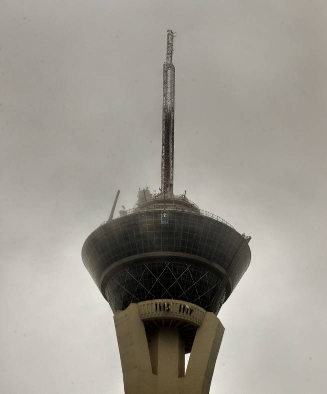 Clouds descend over the Stratosphere as rain soaks the Las Vegas valley on Tuesday, Jan. 9, 2018.