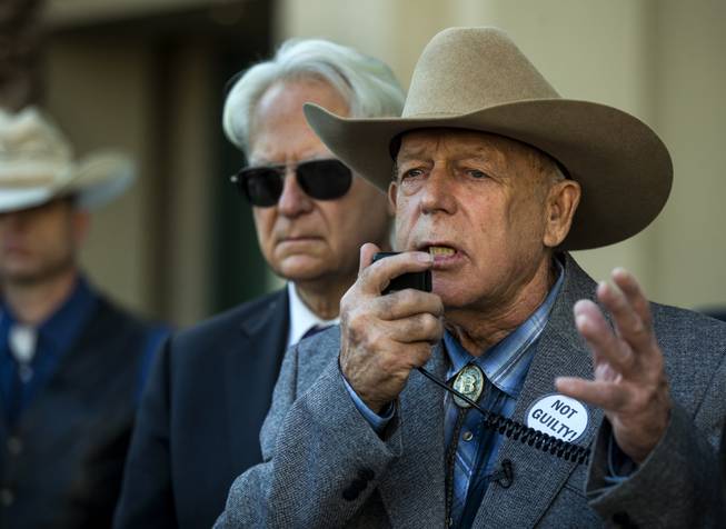 Cliven Bundy is flanked by attorney Larry Layman while speaking about state versus federal rights during a press conference in front of Metro Police Headquarters on Wednesday, Jan. 10, 2018.