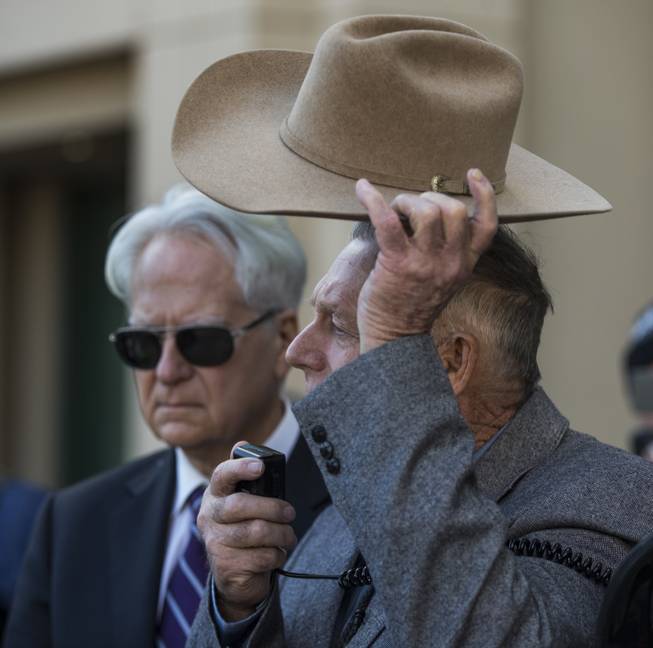 Cliven Bundy tips his hat as he holds a press conference in front of Metro Police Headquarters on Wednesday, Jan. 10, 2018.