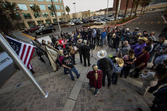 Supporters gather about as Cliven Bundy speaks during his press conference in front of Metro Police Headquarters on Wednesday, Jan. 10, 2018.