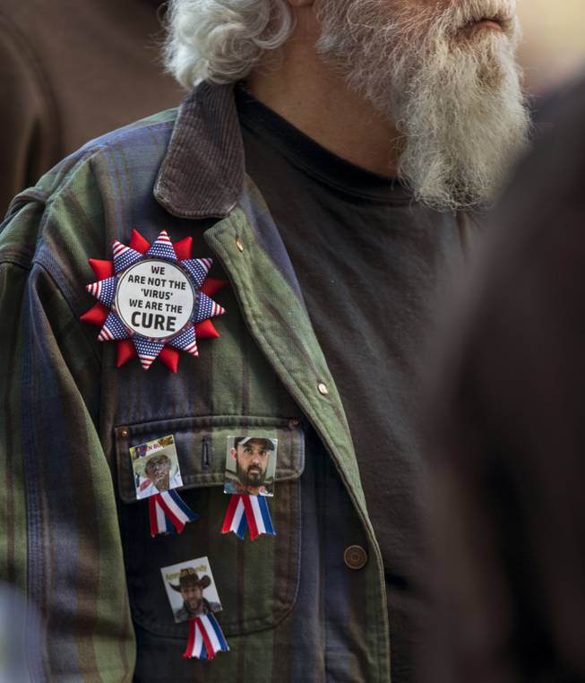 A supporter wears ribbons and a Bundy button as Cliven Bundy speaks during his press conference in front of Metro Police Headquarters on Wednesday, Jan. 10, 2018.