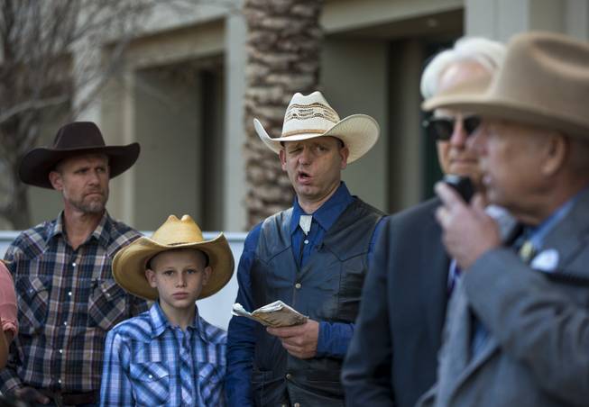 Ryan Bundy relays some Nevada history to his father Cliven Bundy who holds a press conference in front of Metro Police Headquarters on Wednesday, Jan. 10, 2018.