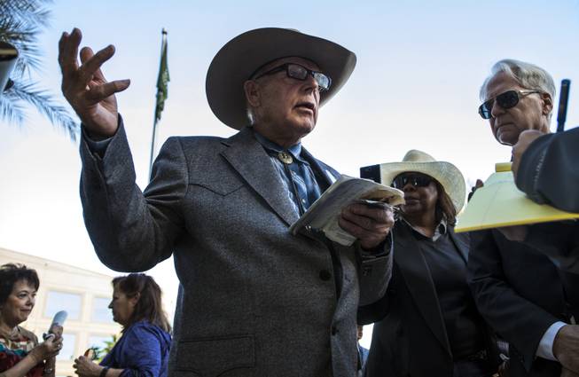 Cliven Bundy refers to his U.S. Constitution while making a point to a reporter following a press conference in front of Metro Police Headquarters on Wednesday, Jan. 10, 2018.