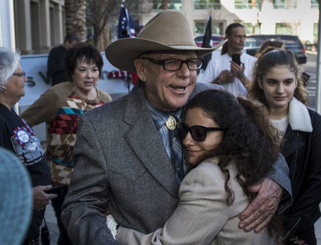 Cliven Bundy hugs Maysoun Fletcher, an attorney for his son Ryan, after holding a press conference in front of Metro Police Headquarters on Wednesday, Jan. 10, 2018.