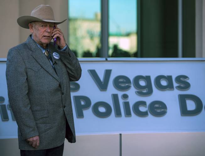 Cliven Bundy makes a call prior to holding a press conference in front of Metro Police Headquarters on Wednesday, Jan. 10, 2018.