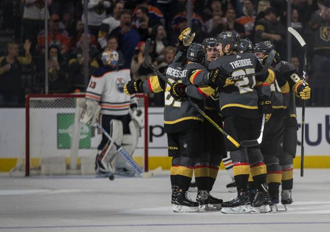 Vegas Golden Knights players come together in celebration after their second goal over the Edmonton Oilers during their game at the T-Mobile Arena on Saturday, Jan. 13, 2018.