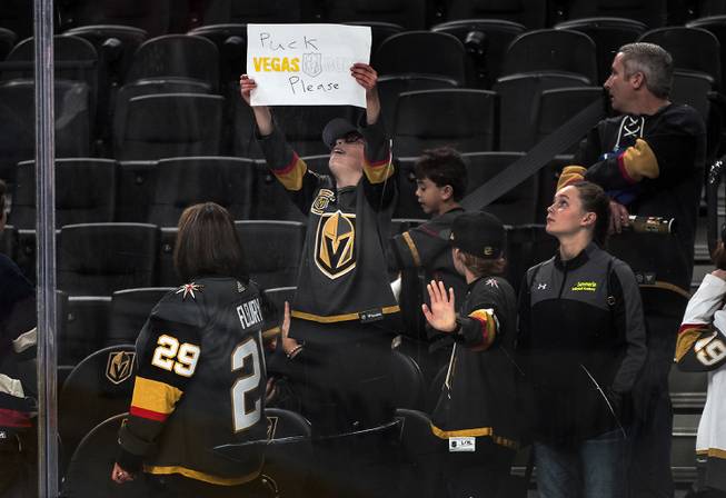 A young Golden Knights fan readies his sign for the players before facing the Edmonton Oilers during their game at the T-Mobile Arena.