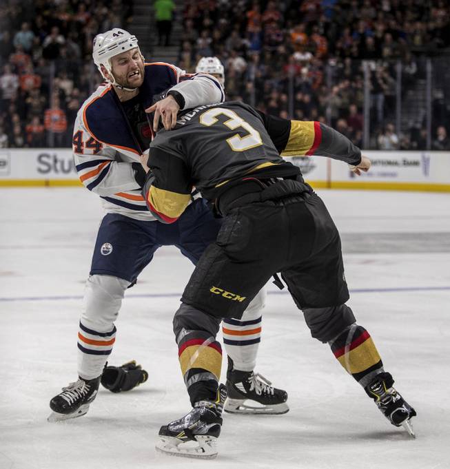 Edmonton Oilers right wing Zack Kassian (44) gets the best of Vegas Golden Knights defenseman Brayden McNabb (3) in a fight during their game at the T-Mobile Arena on Saturday, Jan. 13, 2018.