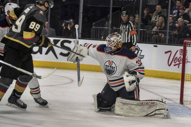 Vegas Golden Knights right wing Alex Tuch (89) just misses with a shot on Edmonton Oilers goaltender Cam Talbot (33) late in their game at the T-Mobile Arena on Saturday, Jan. 13, 2018.