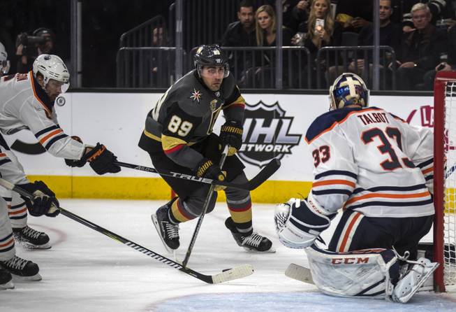 Vegas Golden Knights right wing Alex Tuch (89) eyes a possible shot past \Edmonton Oilers goaltender Cam Talbot (33) late during their game at the T-Mobile Arena on Saturday, Jan. 13, 2018.  L.E. Baskow