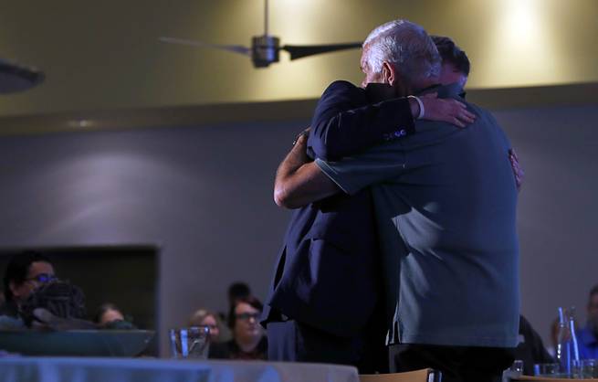 Jim Murren, chairman/CEO of MGM Resorts International, gives a hug to Andrew Hustak, a former Catholic Charities of Southern Nevada client, after Hustak shared his experiences during a news conference at the Three Square food bank Wednesday, Jan. 17, 2018. MGM Resorts International announced a surplus banquet food donation program they hope will provide 800,0000 meals by 2020.
