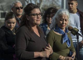 Sheyla Padilla, daughter of Celia Luna, is joined by family members while addressing the media during a plea for information related to her mother's recent homicide at the Express Cash Checking on Jones Boulevard near Vegas Drive on Thursday, Jan. 18, 2018.