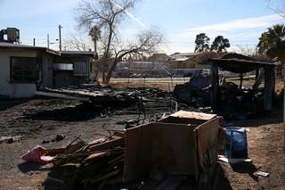 A view of a fatal RV fire next to a vacant house  on Primrose Path, near North Rancho and Vegas drives, Friday, Jan. 26, 2018. One person was found dead in the fire, officials said.