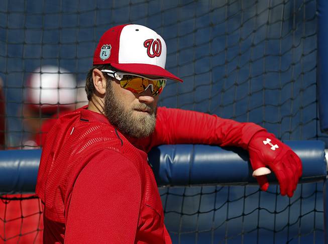 Washington Nationals right fielder Bryce Harper watches batting practice before a spring training baseball game against the New York Yankees Monday, March 20, 2017, in West Palm Beach, Fla. 