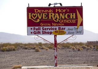 A sign gives direction to Dennis Hof's Love Ranch brothel in Crystal, Dec. 20, 2017.
