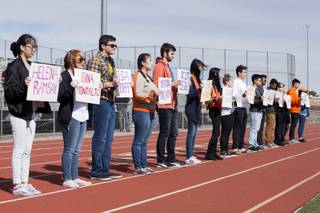 A line of students face the Clark High School student body holding up signs with the names of the victims from the Feb. 14 Marjory Stoneman Douglas High School mass shooting during a 17-minute walkout, Wednesday, March 14, 2018. Clark High School students honored the Parkland, FL Marjory Stoneman Douglas High School shooting victims with seventeen minutes of silence, one minute for each of the victims.
