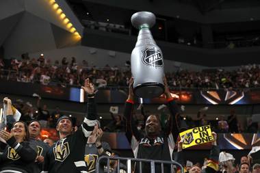 Vegas Golden Knights fans celebrate a score against the Winnipeg Jets during the second period of Game 3 in an NHL Western Conference Finals at T-Mobile Arena, Wednesday, May 16, 2018.