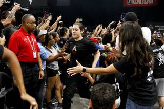 Las Vegas Aces guard Kelsey Plum (10) greets fans as she runs out to the court at the start of their season home opener WNBA game against the Seattle Storm at the Mandalay Bay Event Center, Sunday, May 27, 2018. The Aces lost to the Seattle Storm 105-98.