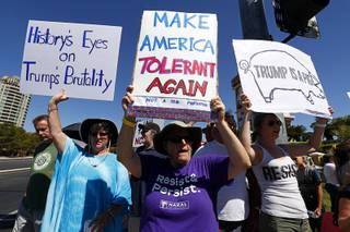 Laurie Lytel, center, and other protesters picket outside the Suncoast before President Donald Trump's address to the Nevada State GOP Convention in Summerlin on Saturday, June 23, 2018.