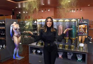 Owner Lissette Waugh plays with glitter at L Makeup Institute, a makeup school and cosmetic store, at Tivoli Village, 440 S. Rampart Blvd., Thursday, July 12, 2018.