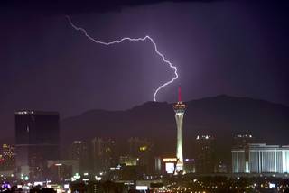 A bolt of lightning flashes north of Las Vegas as a storm passes through the valley Thursday, July 19, 2018.