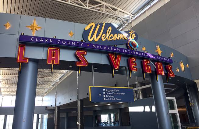 A sign welcomes travelers at McCarran International Airport.