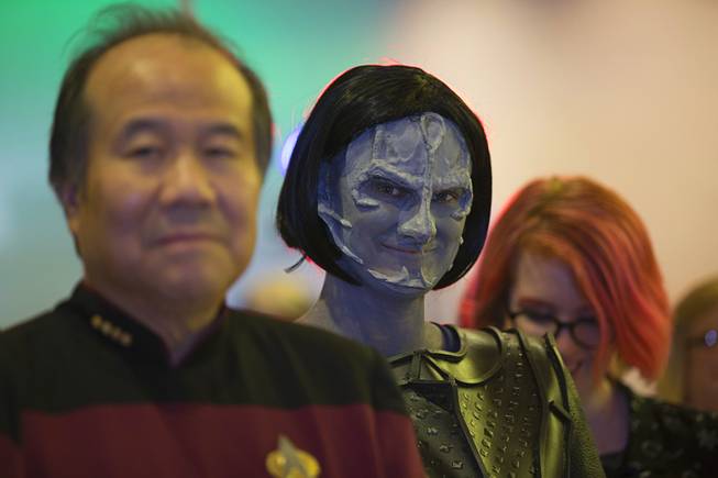 Teresa Sint, center, dressed as "Gul Dukat," (Deep Space Nine) waits in line to have her caricature drawn during the 2018 Official Star Trek Convention Las Vegas at the Rio Friday, Aug. 3, 2018. The convention continues through Sunday.