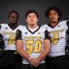 Members of the Clark High football team pose for a photo at the Las Vegas Sun's high school football media day Tuesday July 31, 2018 at the Red Rock Resort and Casino. They include, from left, Isaiah Bigby, Marcus Perez and Jared Jenkins.