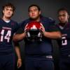 Members of the Coronado High football team pose for a photo at the Las Vegas Sun's high school football media day Tuesday July 31, 2018 at the Red Rock Resort and Casino. They include, from left, Gavin Wale, Riley Danielson and Semaj Bolin.