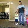 In this photo taken Tuesday, Aug. 28, 2018, Louis Alberto Enamorado Gomez stands with his daughter, Jeydi, 1, and son, Justin, 3, at their home in Grandview, Mo. Living in the U.S. since 2005, Gomez is fighting a deportation order stemming from a 2012 DUI charge because he fears what his removal would mean for his seven children, all U.S. citizens for whom he is the sole provider. 