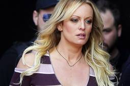 In this Thursday, Oct. 11, 2018, file photo, adult film actress Stormy Daniels arrives for the opening of the adult entertainment fair "Venus," in Berlin.