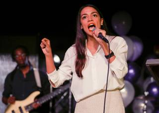 New York Democratic Congressional candidate Alexandria Ocasio-Cortez speaks to supporters, Tuesday, Nov. 6, 2018 in Queens the Queens borough of New York, after defeating Republican challenger Anthony Pappas in the race for the 14th Congressional district of New York. (AP Photo/Stephen Groves)